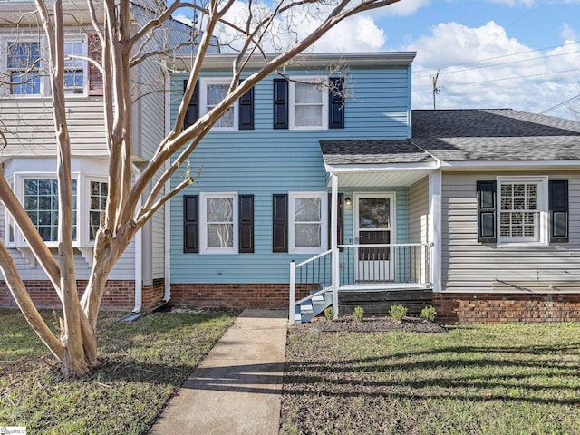 view of front of home with a front yard