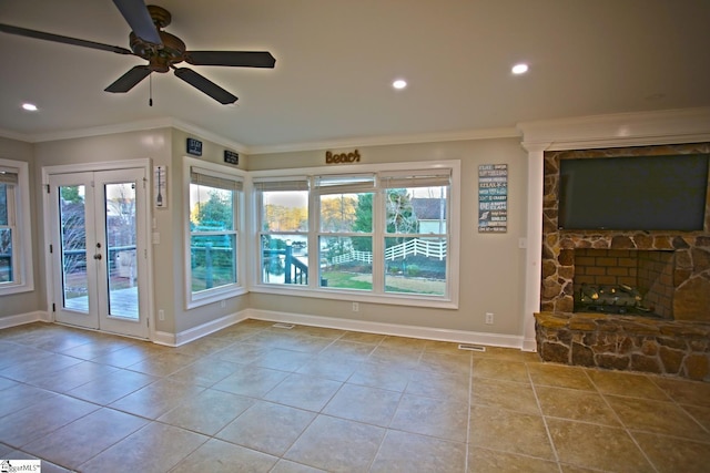 unfurnished living room with ceiling fan, french doors, light tile patterned flooring, and ornamental molding