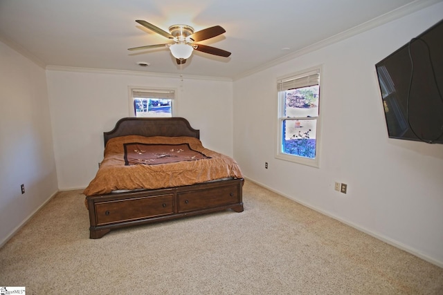 bedroom with ceiling fan, light colored carpet, and ornamental molding