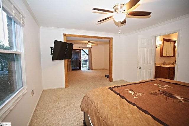 carpeted bedroom with ceiling fan and crown molding