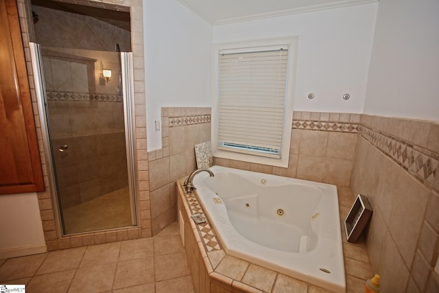 bathroom with crown molding, tile patterned flooring, tile walls, and shower with separate bathtub