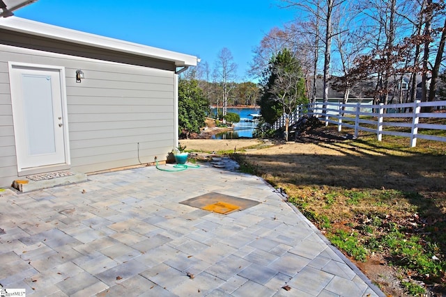 view of patio featuring a water view