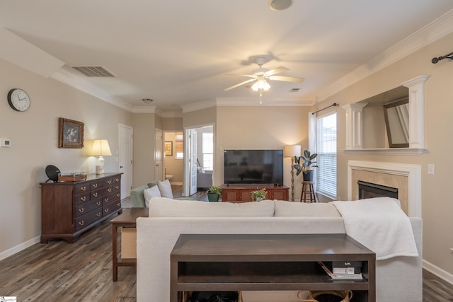 living room featuring ceiling fan, dark wood-type flooring, and ornamental molding