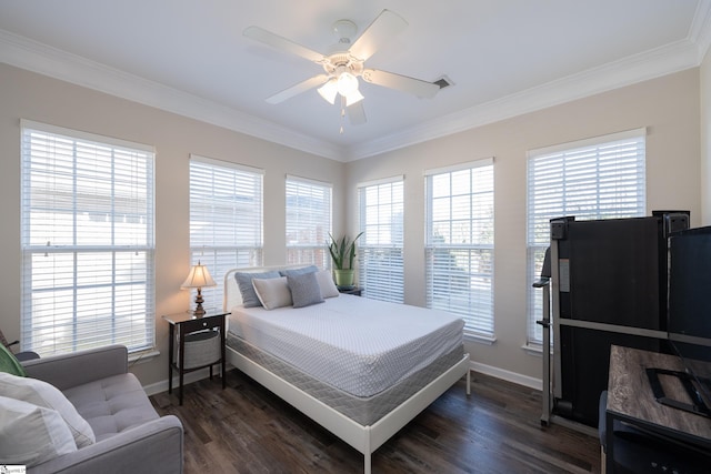 bedroom featuring ceiling fan, dark hardwood / wood-style flooring, and crown molding