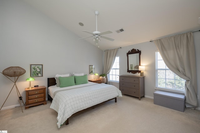 bedroom featuring ceiling fan, high vaulted ceiling, and light colored carpet