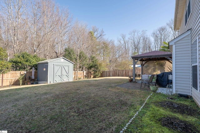 view of yard featuring a gazebo and a shed