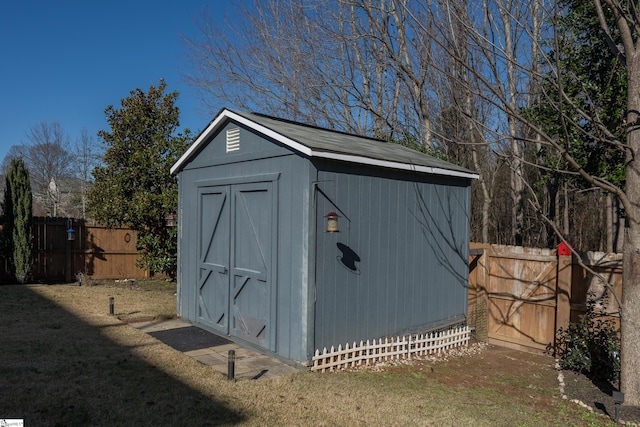 view of outbuilding with a lawn