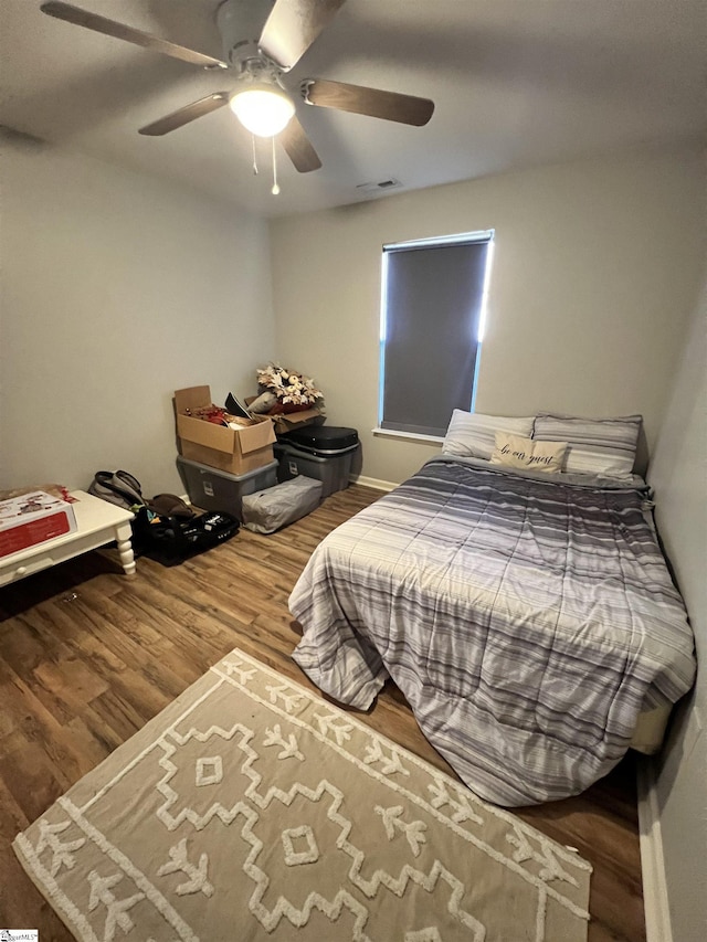 bedroom featuring ceiling fan and hardwood / wood-style flooring