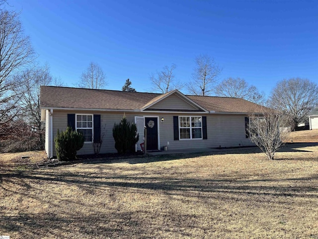 ranch-style house with a front lawn