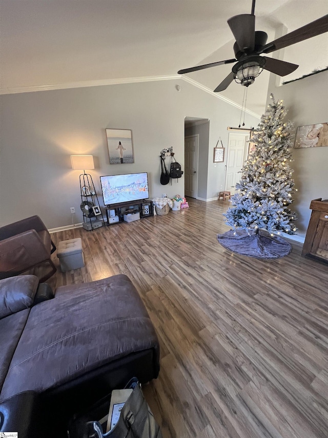 living room with ceiling fan, wood-type flooring, crown molding, and vaulted ceiling