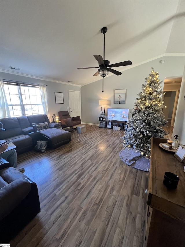 living room featuring ceiling fan, dark hardwood / wood-style flooring, crown molding, and vaulted ceiling