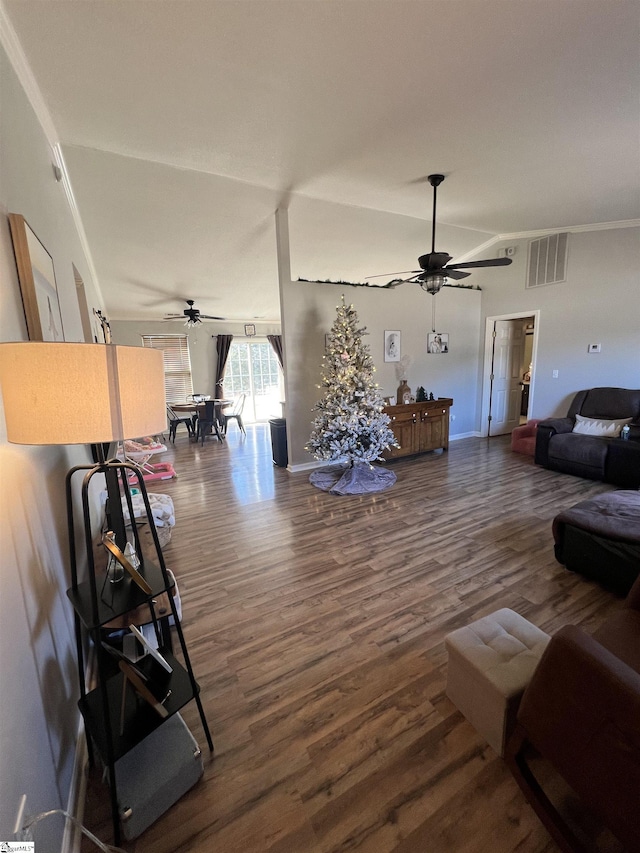 living room featuring ceiling fan and hardwood / wood-style flooring