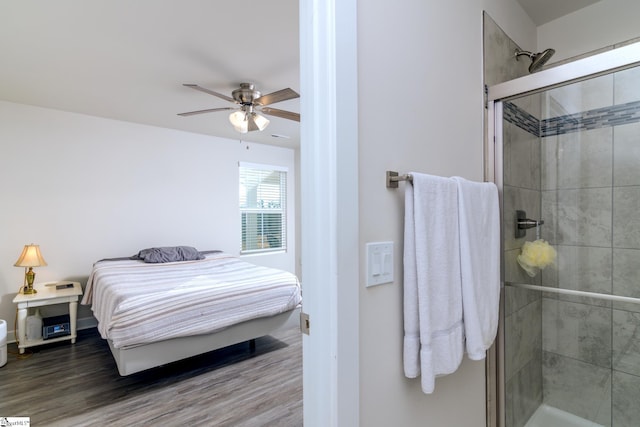 bedroom with ceiling fan and wood-type flooring