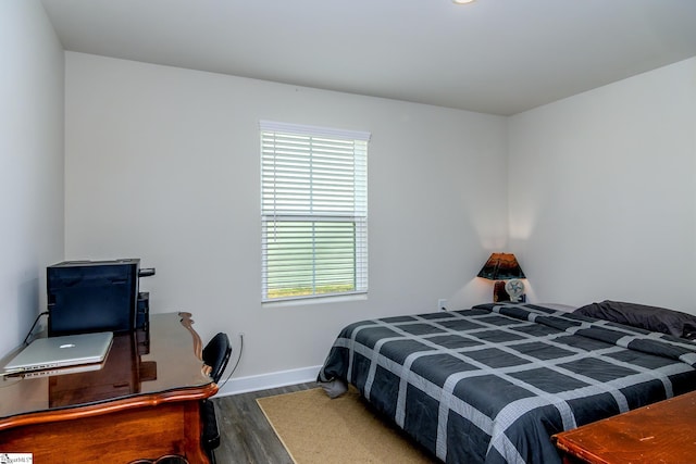 bedroom with wood-type flooring