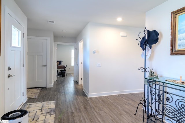 corridor featuring dark wood-type flooring