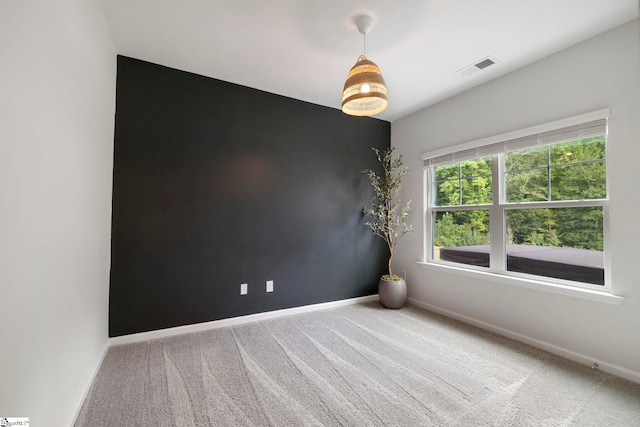 unfurnished room featuring carpet flooring