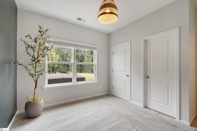 unfurnished bedroom featuring carpet flooring