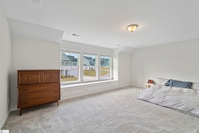 bedroom with light carpet