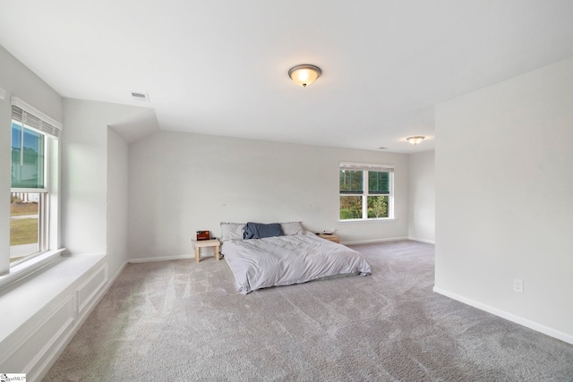 unfurnished bedroom with light colored carpet