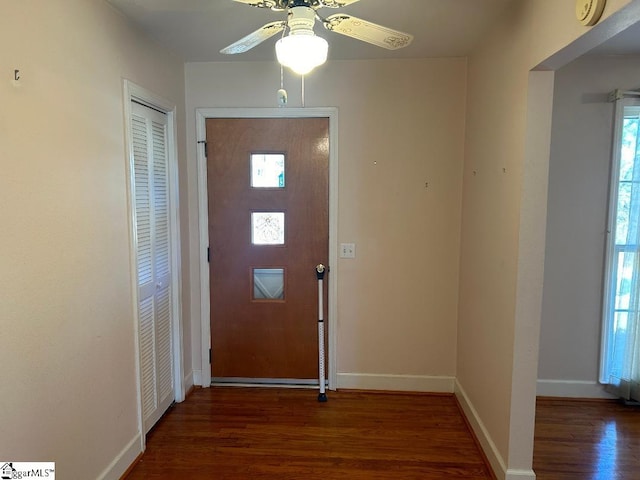 doorway to outside with dark hardwood / wood-style floors, a healthy amount of sunlight, and ceiling fan