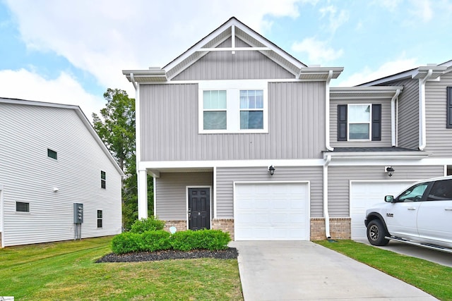 view of front of home featuring a front yard and a garage