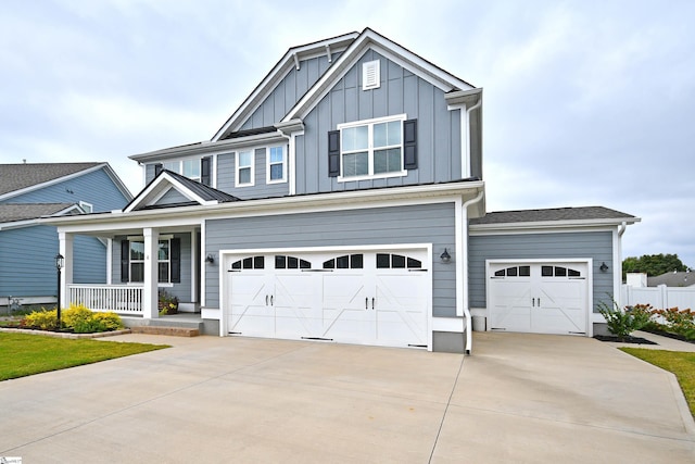 craftsman inspired home with a porch and a garage