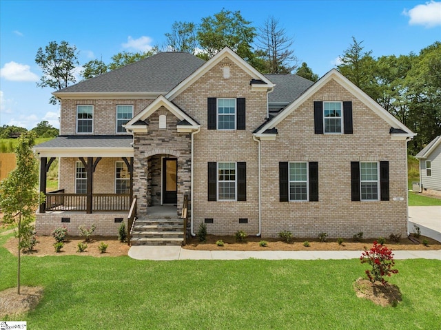 view of front of home with a front yard and a porch