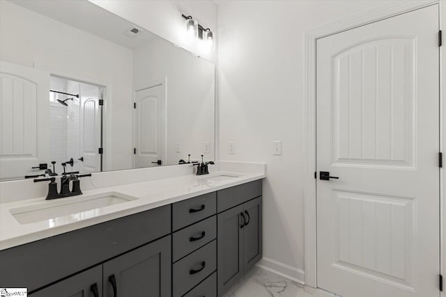 bathroom with a shower and vanity