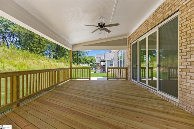 wooden terrace featuring ceiling fan