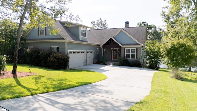 view of front of property featuring a garage and a front lawn