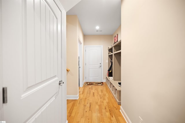 mudroom with light hardwood / wood-style floors