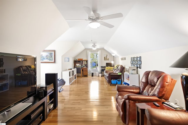 interior space with ceiling fan, light hardwood / wood-style floors, and vaulted ceiling