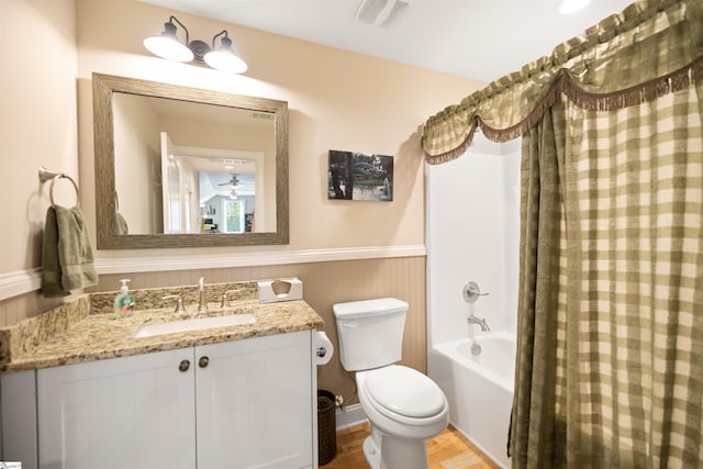 full bathroom featuring shower / tub combo with curtain, vanity, and toilet