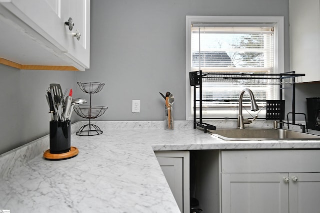 kitchen with sink and white cabinets