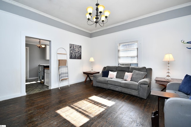 living room featuring dark hardwood / wood-style flooring, crown molding, and an inviting chandelier