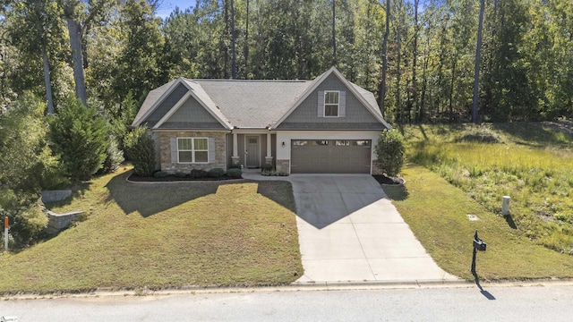 craftsman house with a garage and a front lawn