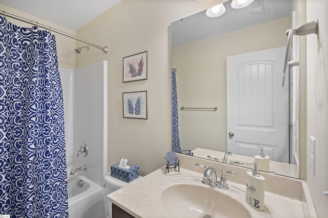 full bathroom featuring shower / bathtub combination with curtain, vanity, and toilet