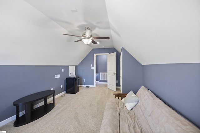 additional living space featuring ceiling fan, lofted ceiling, and light carpet