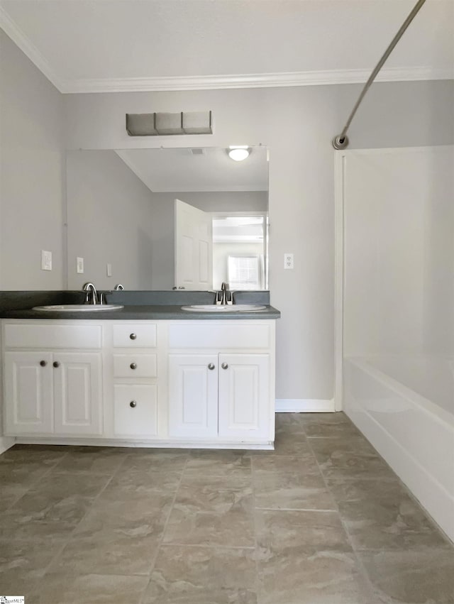 bathroom with vanity, crown molding, and shower / washtub combination