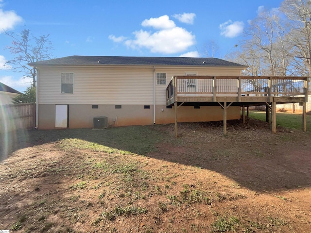 back of house with a deck and central air condition unit