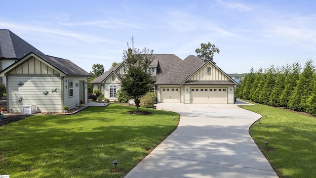 craftsman inspired home featuring a garage and a front yard