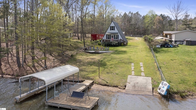 view of yard with a boat dock and a water view