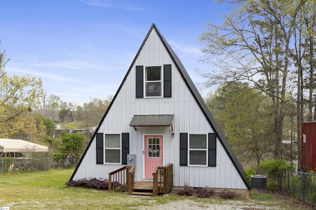 modern farmhouse featuring a front yard and central AC