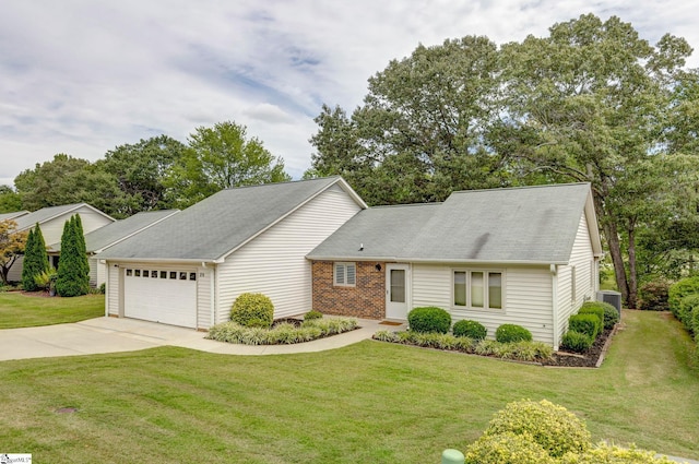 view of front of house featuring a garage, a front yard, and cooling unit