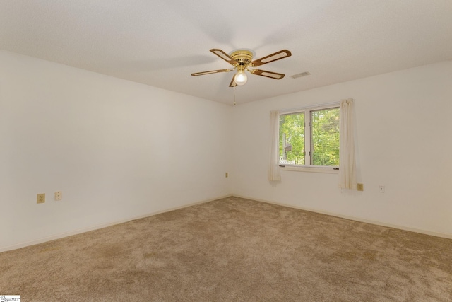 empty room with carpet floors and ceiling fan