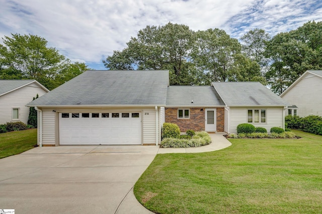 view of front of home featuring a garage and a front yard