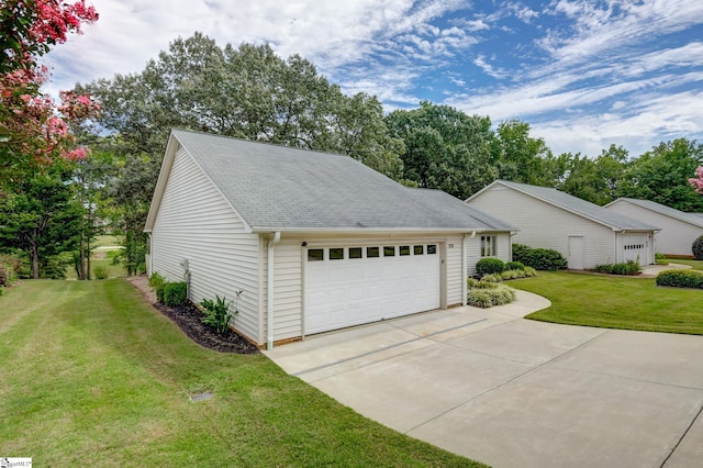 garage featuring a lawn