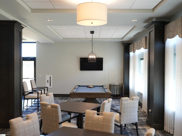 interior space with pool table and a raised ceiling