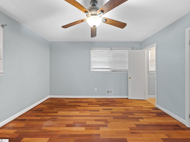 unfurnished room featuring ceiling fan and hardwood / wood-style floors