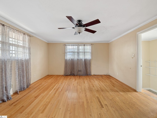 empty room featuring light hardwood / wood-style flooring, ceiling fan, and ornamental molding